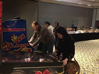 people playing arcade games